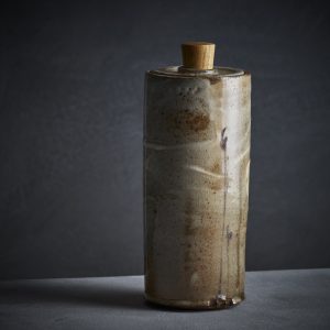 Lidded jar with bulrush motif