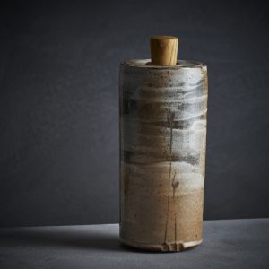 Lidded jar with bulrush motif