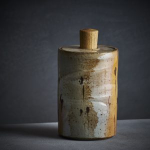 Lidded jar with bulrush motif